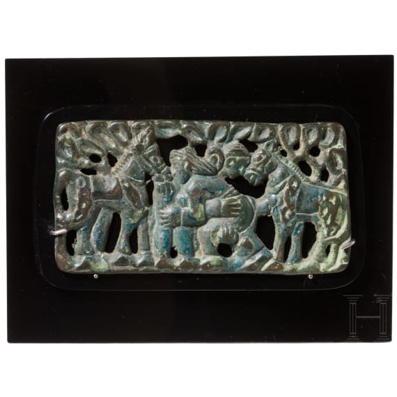 A rare nomadic horsemen&rsquo;s belt plaque from the Ordos region, depicting two wrestlers flanked by horses, Mongolia, 2nd&ndash;1st centuries B.C.