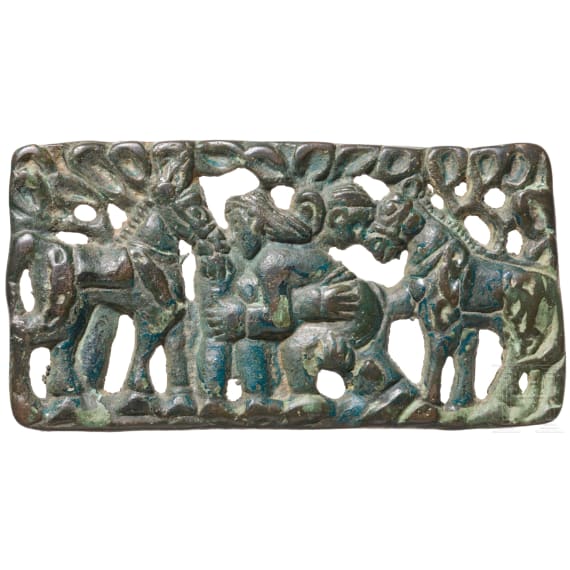 A rare nomadic horsemen&rsquo;s belt plaque from the Ordos region, depicting two wrestlers flanked by horses, Mongolia, 2nd&ndash;1st centuries B.C.