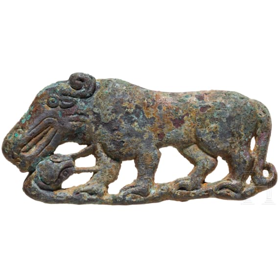 Bronze appliqu&eacute; depicting a big cat holding a snake in its paws, 4th century B.C.