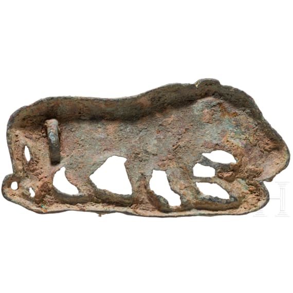Bronze appliqu&eacute; depicting a big cat holding a snake in its paws, 4th century B.C.