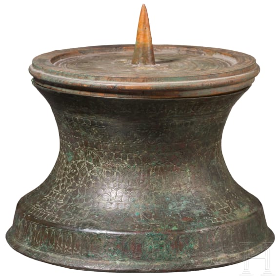 Bronze base of a candlestick, entirely chased with floral and figurative motifs, as well as inscriptions; Seljuk, 12th&ndash;13th centuries