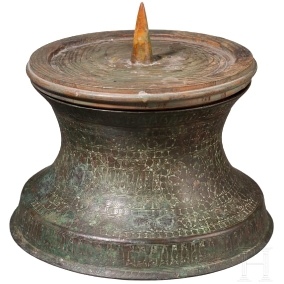 Bronze base of a candlestick, entirely chased with floral and figurative motifs, as well as inscriptions; Seljuk, 12th&ndash;13th centuries