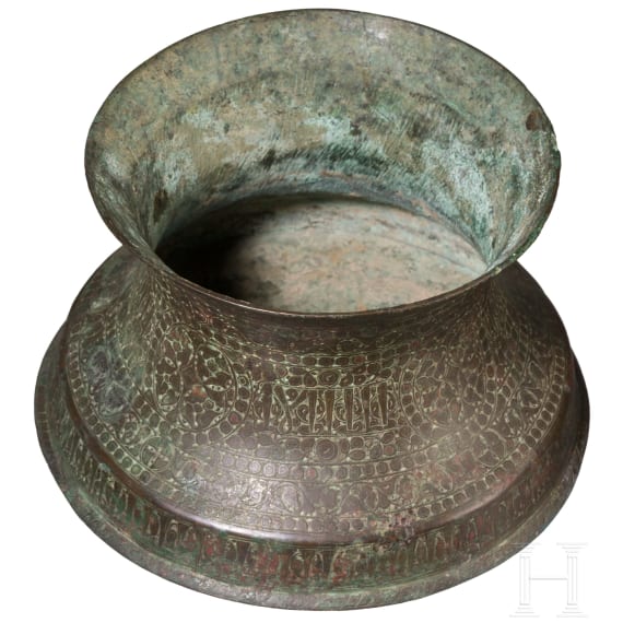 Bronze base of a candlestick, entirely chased with floral and figurative motifs, as well as inscriptions; Seljuk, 12th&ndash;13th centuries