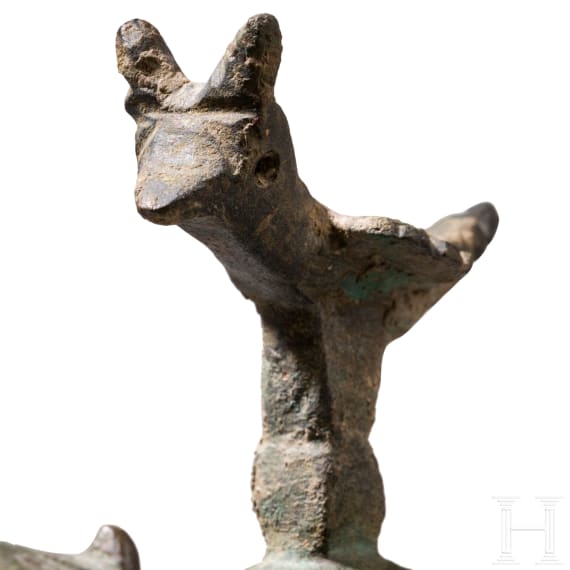 Bronze oil lamp on a disc-shaped base with floral and figurative decoration, Seljuk, 12th&ndash;13th centuries