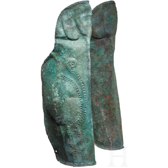 Two anatomically shaped greaves with dotted-and-knobbed decoration, from southern Italy, 5th&ndash;4th centuries B.C.