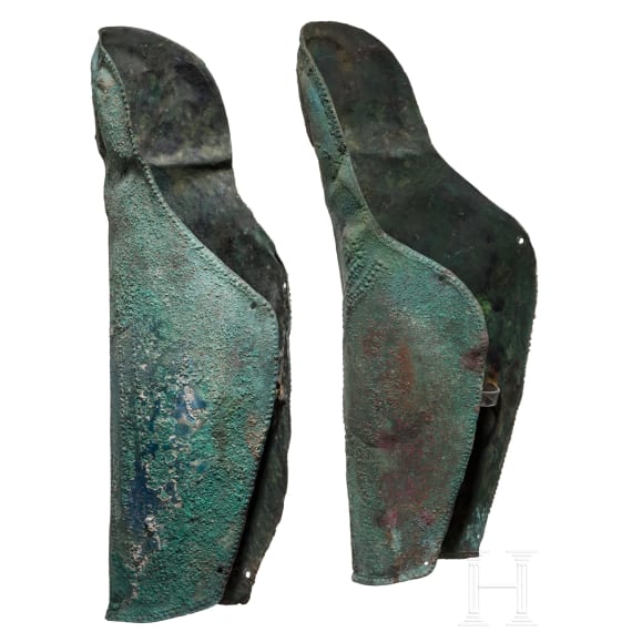 Two anatomically shaped greaves with dotted-and-knobbed decoration, from southern Italy, 5th&ndash;4th centuries B.C.