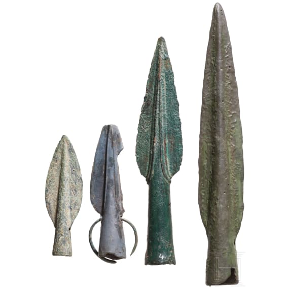 A pair of Early Iron Age bronze fibulae with a double spiral and an olive-green patina, 9th&ndash;8th centuries B.C.