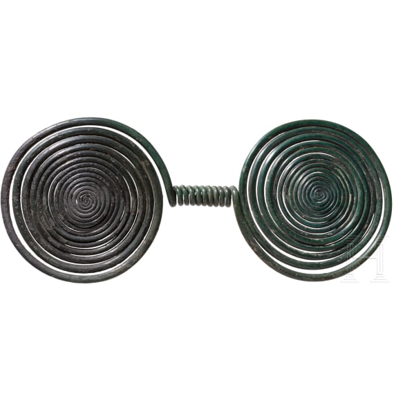 Late Bronze Age double spiral with a dark green patina, 9th century B.C.