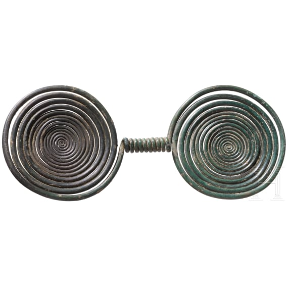 Late Bronze Age double spiral with a dark green patina, 9th century B.C.
