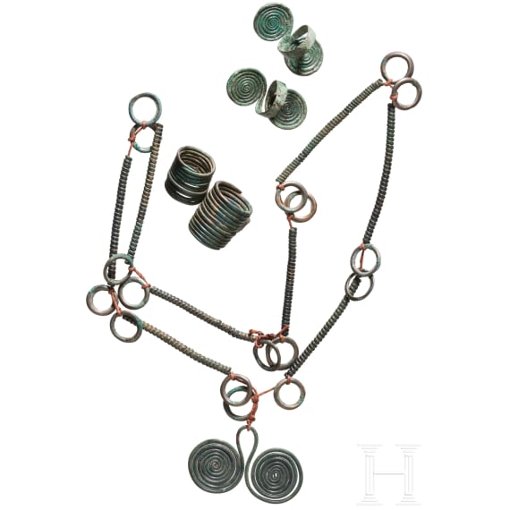 A set of Bronze Age jewellery, strung in modern times, together with two finger rings and two curl rings, 10th&ndash;9th centuries B.C.