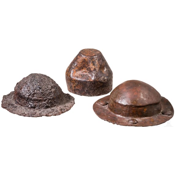 Two iron shield bosses and an iron cladding, 6th century A.D.