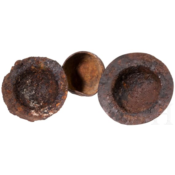 Two iron shield bosses and an iron cladding, 6th century A.D.