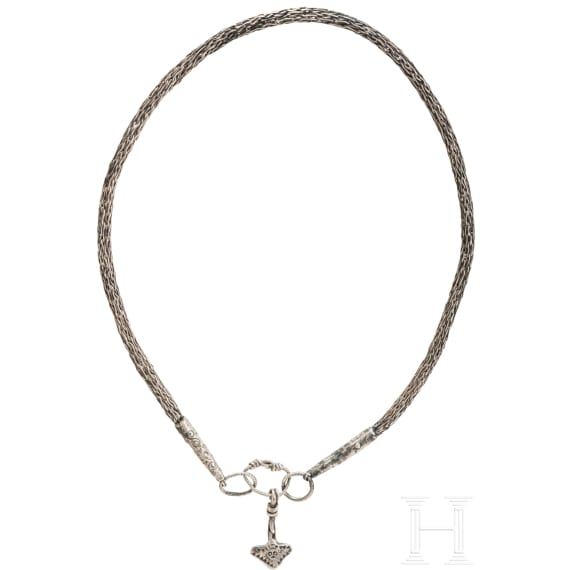 Ornate Thor&rsquo;s hammer on a solid silver foxtail chain, Viking, 10th century.