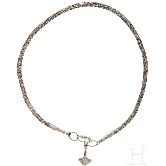 Ornate Thor&rsquo;s hammer on a solid silver foxtail chain, Viking, 10th century.