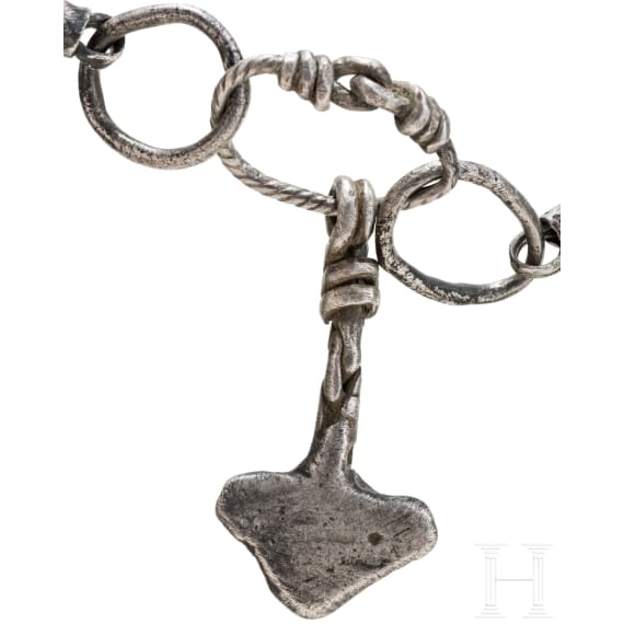 Ornate Thor&rsquo;s hammer on a solid silver foxtail chain, Viking, 10th century.