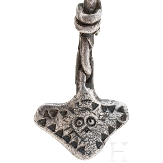 Ornate Thor&rsquo;s hammer on a solid silver foxtail chain, Viking, 10th century.