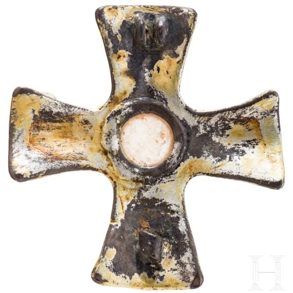 A brooch made of gold-plated silver in the shape of a cross, depicting Odin and his ravens, Viking, 10th century.
