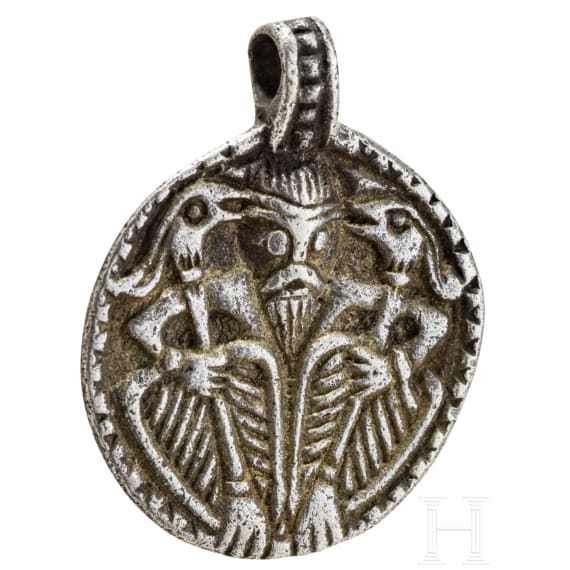 Round silver pendant depicting Thor with Hugin and Munin, 10th century.