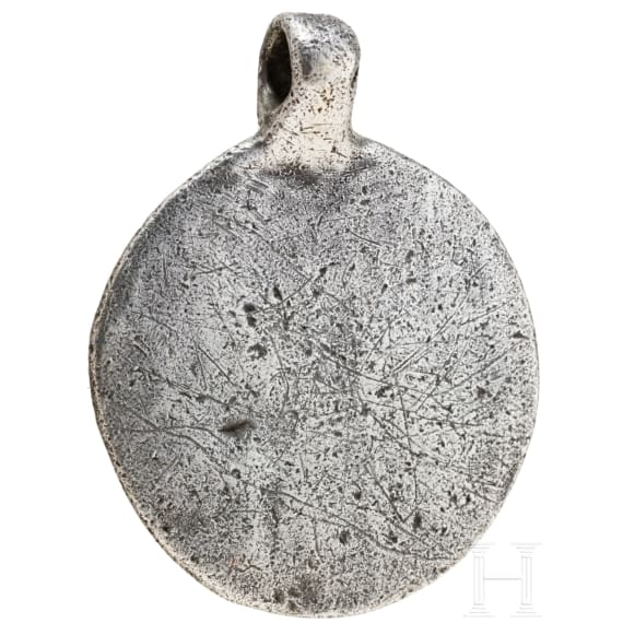 Round silver pendant depicting Thor with Hugin and Munin, 10th century.