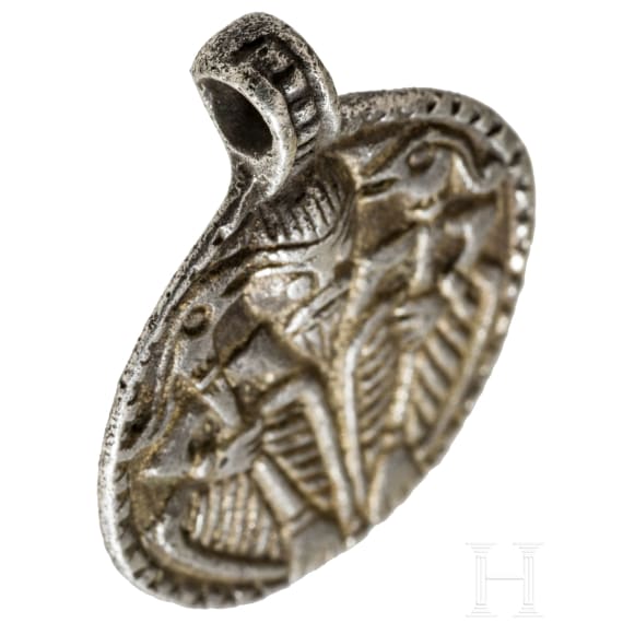 Round silver pendant depicting Thor with Hugin and Munin, 10th century.