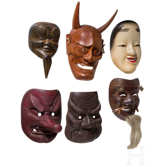Sechs Masken aus Gusseisen und Holz, Japan, 20. Jhdt.