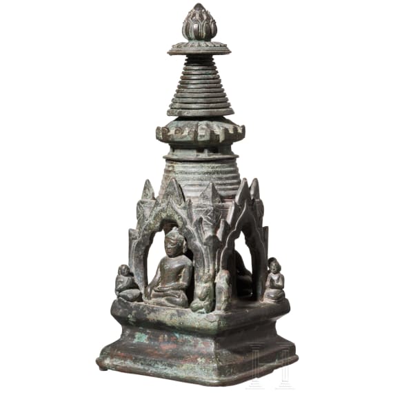 Bronze votive stupa with a reliquary chamber and depictions of Shakyamuni Buddha, flanked by two worshippers. Pagan Kingdom (Myanmar), 12th &ndash; 13th centuries.