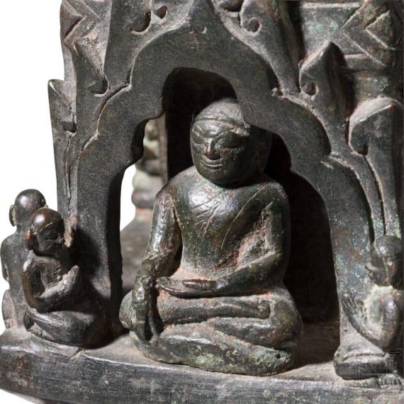 Bronze votive stupa with a reliquary chamber and depictions of Shakyamuni Buddha, flanked by two worshippers. Pagan Kingdom (Myanmar), 12th &ndash; 13th centuries.