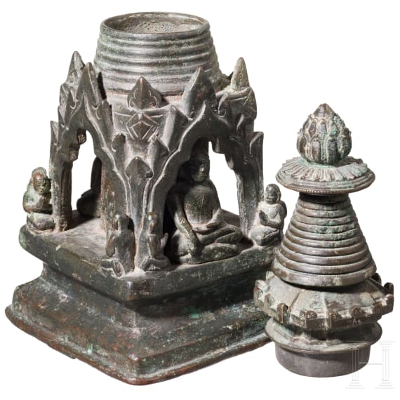 Bronze votive stupa with a reliquary chamber and depictions of Shakyamuni Buddha, flanked by two worshippers. Pagan Kingdom (Myanmar), 12th &ndash; 13th centuries.