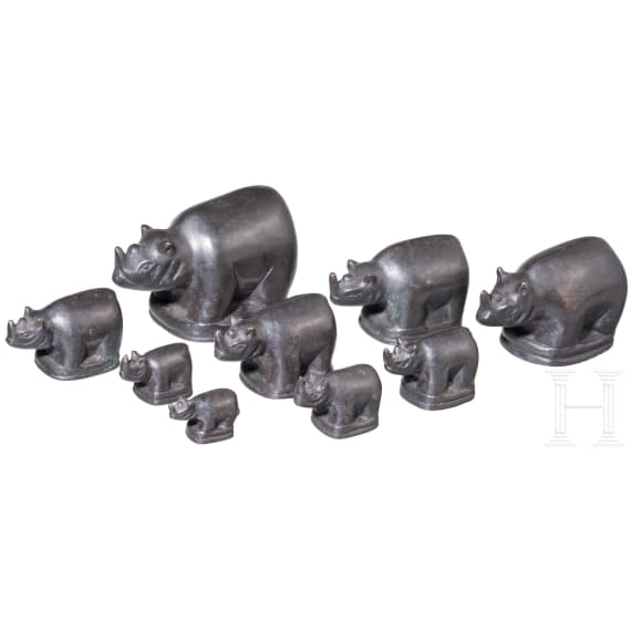 Nine rhino-shaped bronze opium weights, Burma, 20th century