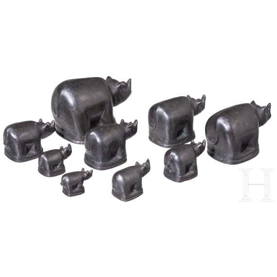 Nine rhino-shaped bronze opium weights, Burma, 20th century