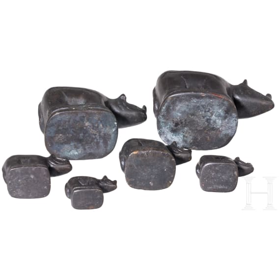 Nine rhino-shaped bronze opium weights, Burma, 20th century
