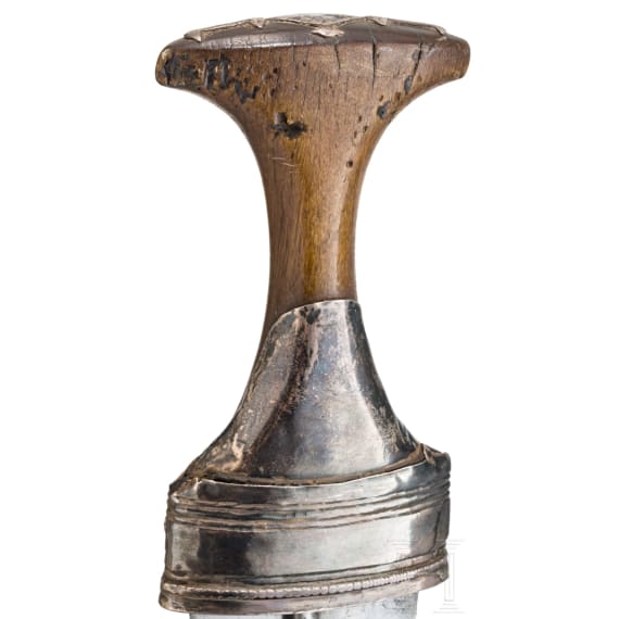 A silver mounted Oman jambiya with rhino horn hilt, ca. 1900