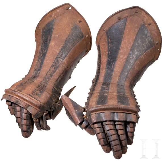A pair of German black-and-white armoured gauntlets retaining their authentic Leather lining, ca. 1580