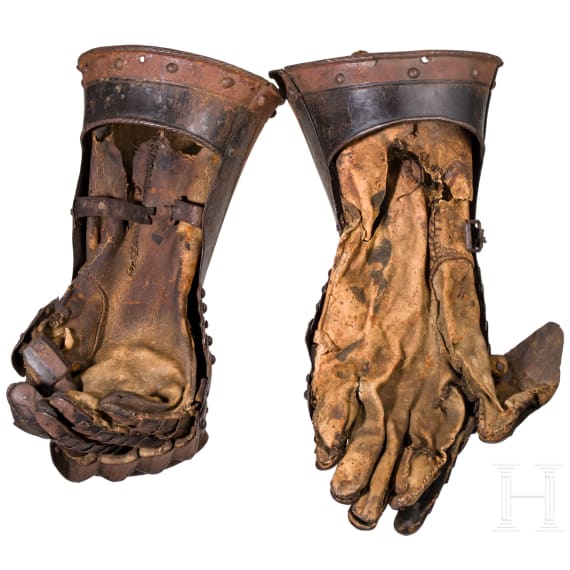 A pair of German black-and-white armoured gauntlets retaining their authentic Leather lining, ca. 1580