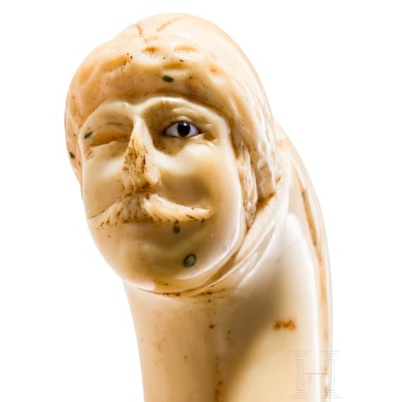 A Dutch or Flemish cane grip carved from sperm whale tooth, mid-18th century