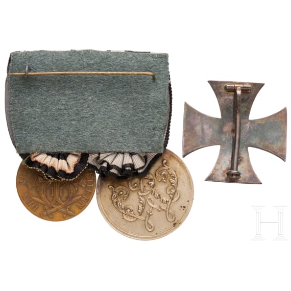 Two-piece colonial medal buckle and an Iron Cross, 1st Class, 1914