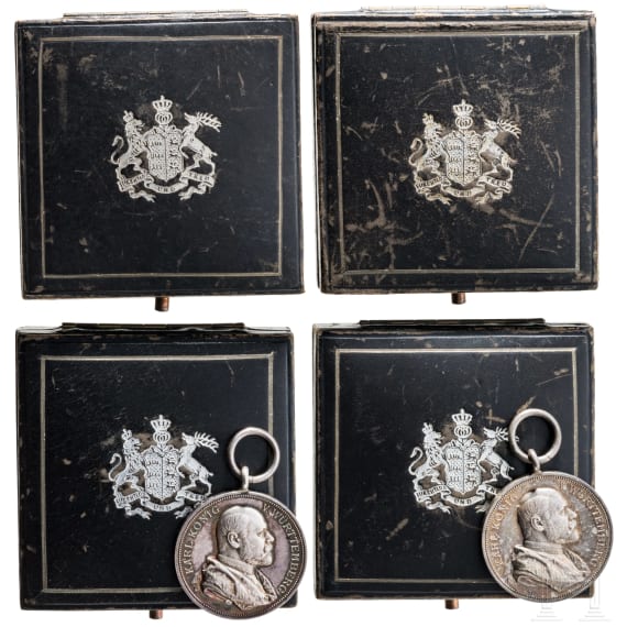 Two silver commemorative medals marking the 25th anniversary of King Charles's reign in 1889 and two cases