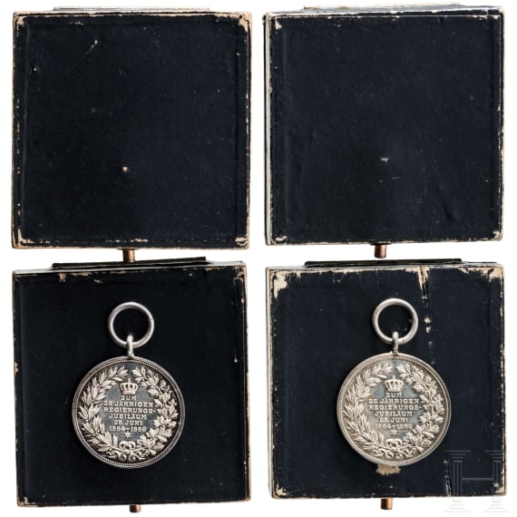 Two silver commemorative medals marking the 25th anniversary of King Charles's reign in 1889 and two cases