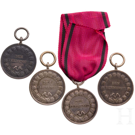Four silver King Karl Civil Service Medals