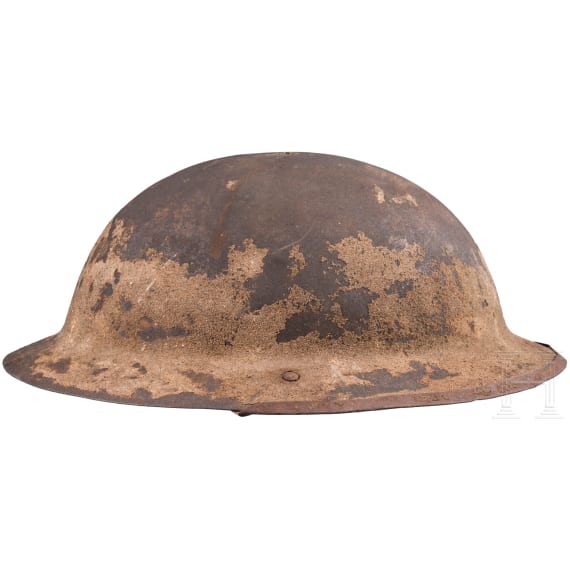 A MK I &ldquo;Brodie&rdquo; steel helmet, an early production model with an additional rail for the face guard