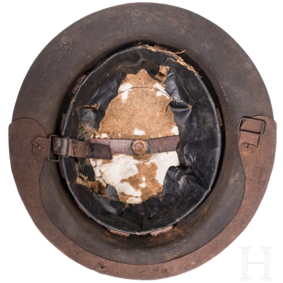 A MK I &ldquo;Brodie&rdquo; steel helmet, an early production model with an additional rail for the face guard