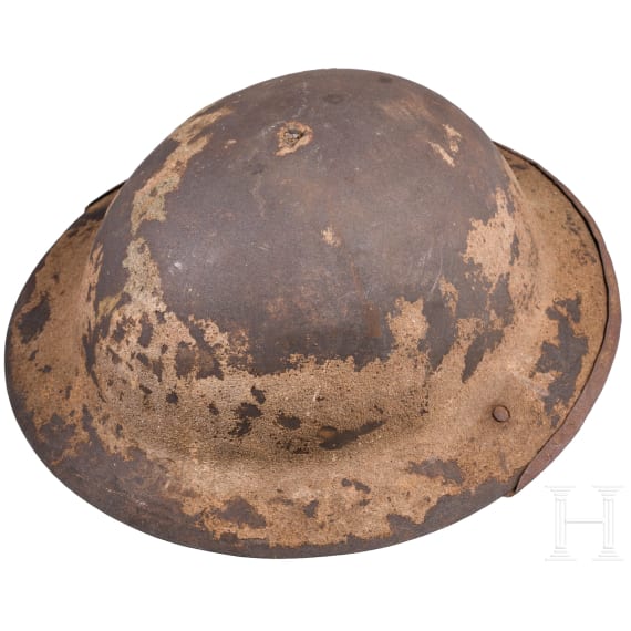 A MK I &ldquo;Brodie&rdquo; steel helmet, an early production model with an additional rail for the face guard