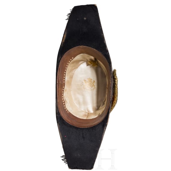 A bicorne hat and a pair of epaulettes for naval officers, circa 1900