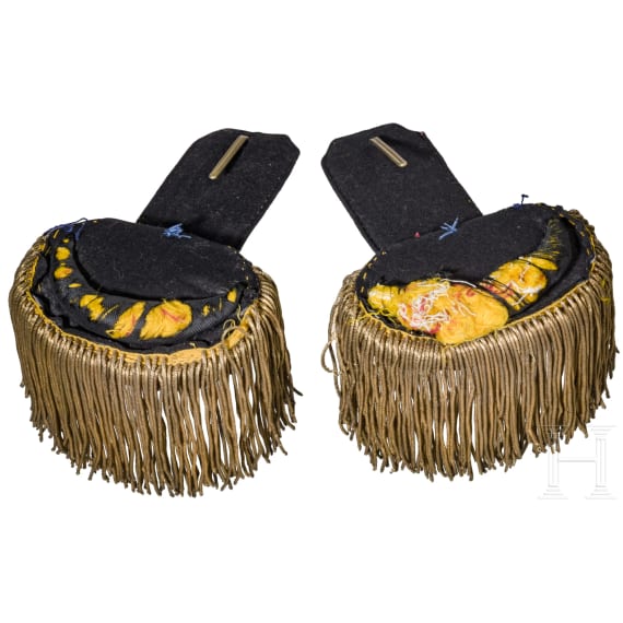 A bicorne hat and a pair of epaulettes for naval officers, circa 1900