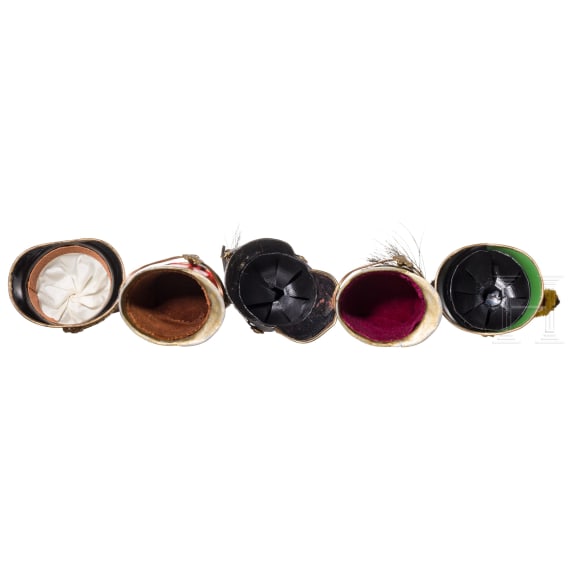 Five Austrian miniature helmets (ball donations), second half of the 20th century