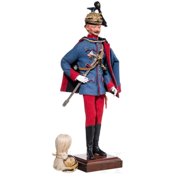 A miniature figure of an officer in the Austro-Hungarian Uhlan Regiment No. 5 and a miniature helmet, 20th century