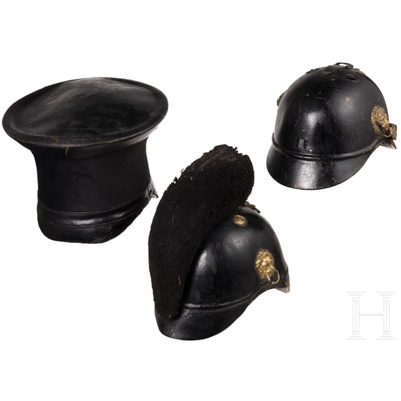 Two fragmentary helmets M 1868 and a shako body, 19th century