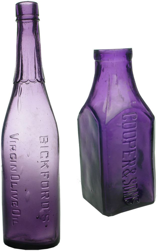 Pair of Dark Sun Coloured Amethyst bottles. Bickfords Olive Oil and Cooper Pickle.