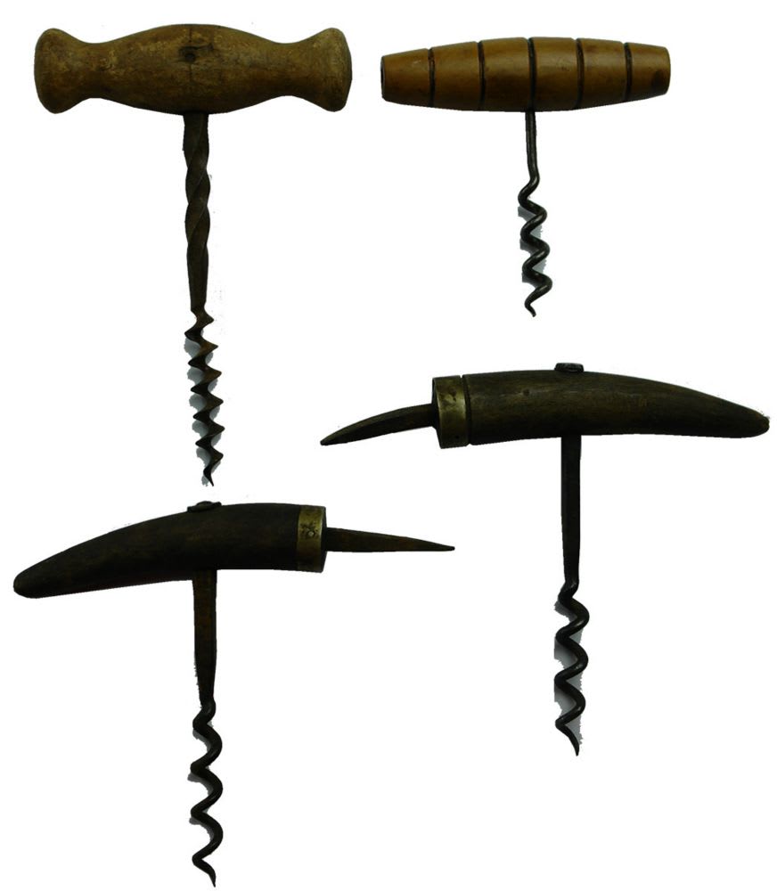 Four early wooden handled corkscrews.