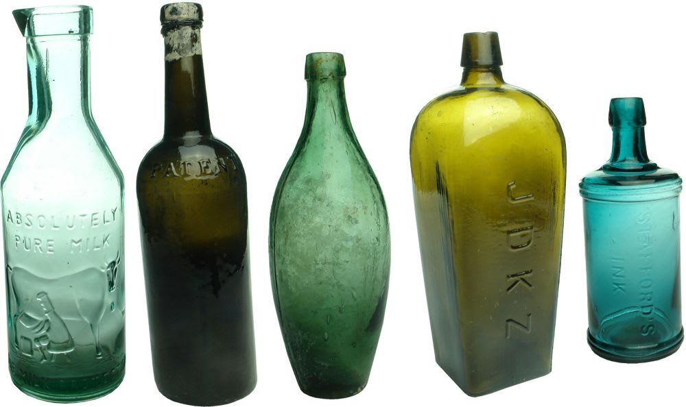 Five assorted bottles. Modern Milk, Black Patent, Skittle, JDKZ Gin & Staffords Ink